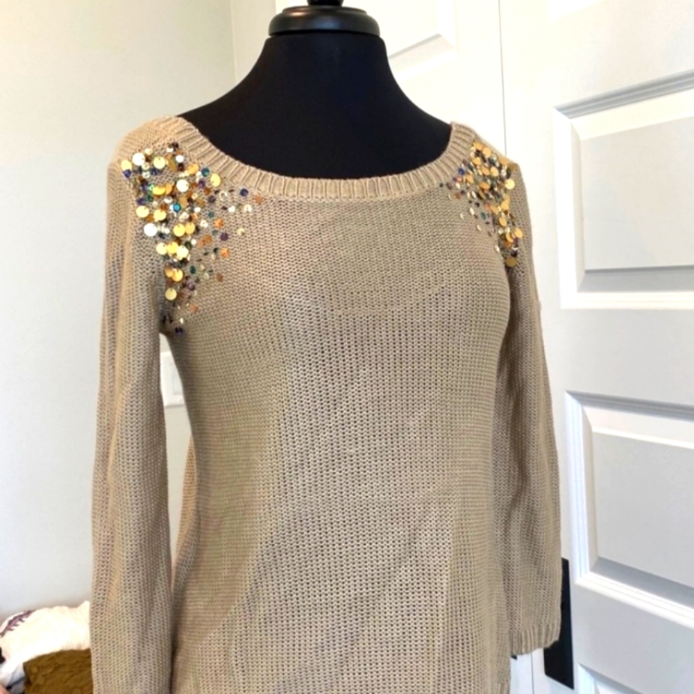 Super cute gold colored sweater with colorful sequin detail on shoulder